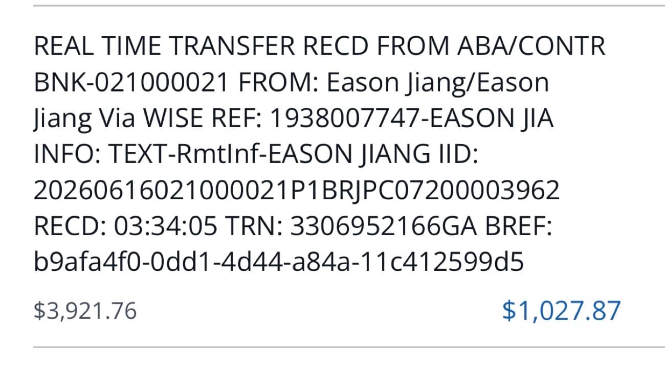 Real-time bank transfer received via Wise, $1,027.87 credited